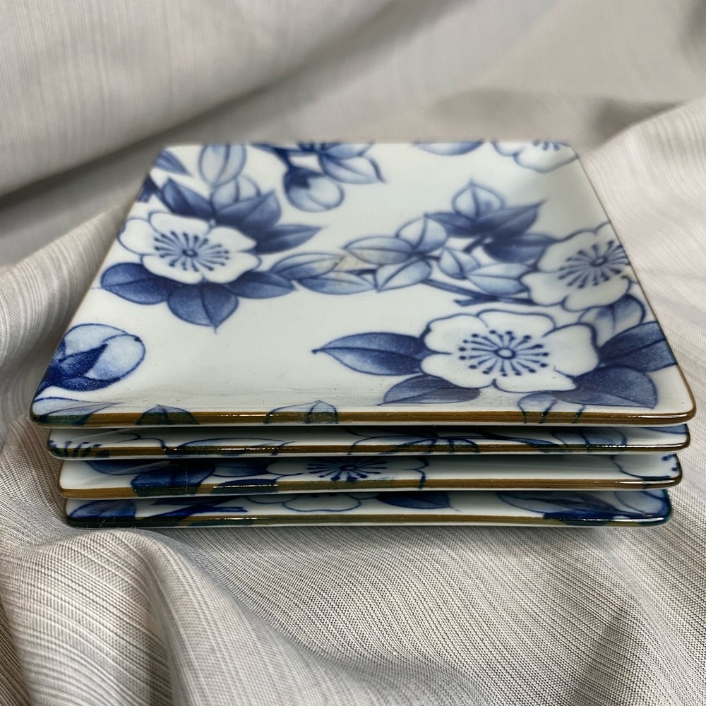 Set of 4 floral appetizer plates.